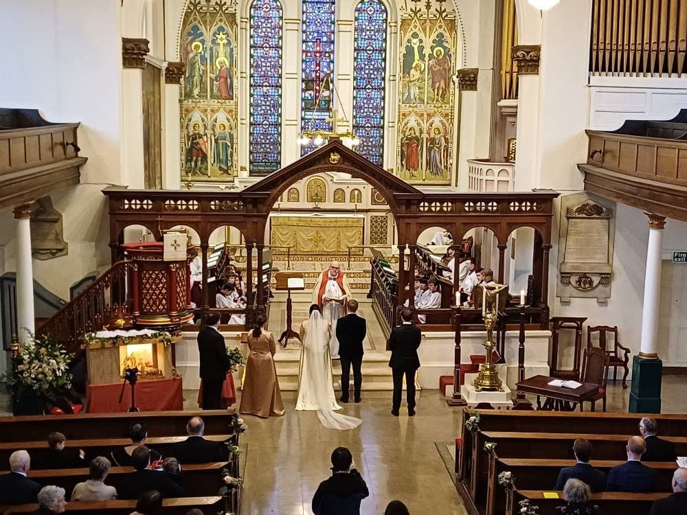 A wedding ceremony before the chancel of St George's